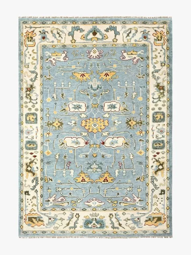 A hand knotted and artisian crafted wool rug.