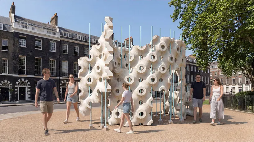 by day, the lightweight mycelium modules create an open enclosure that balances shelter, visibility, and circulation