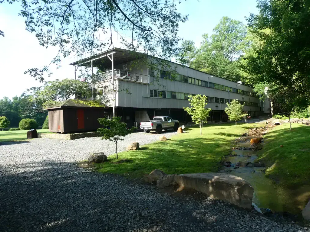 A view of a building at Black Mountain College, which is crumbling due to disinvestment