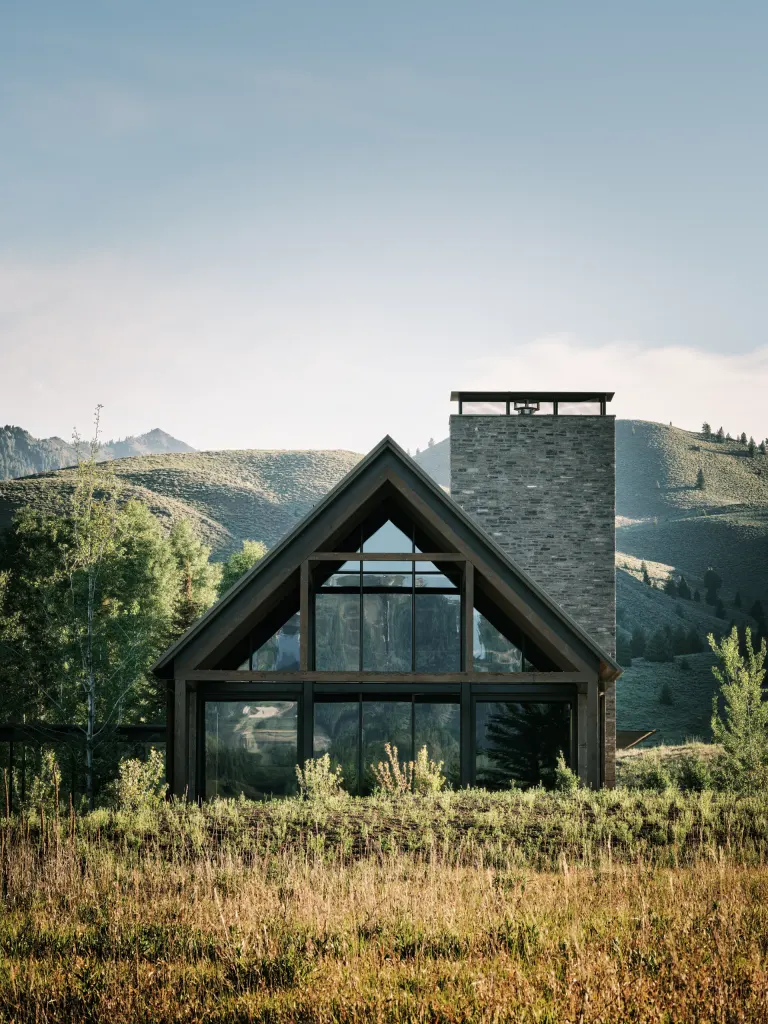 Three Barns by Field Architecture, a rural american home designed to look like a collection of old wooden barns
