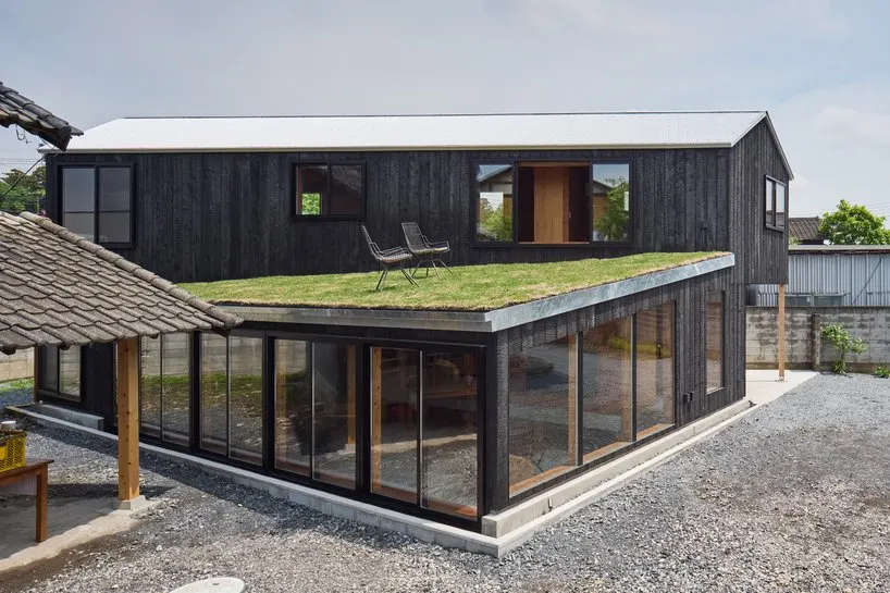 the grass roof is nurtured by automatic irrigation using water from the existing well