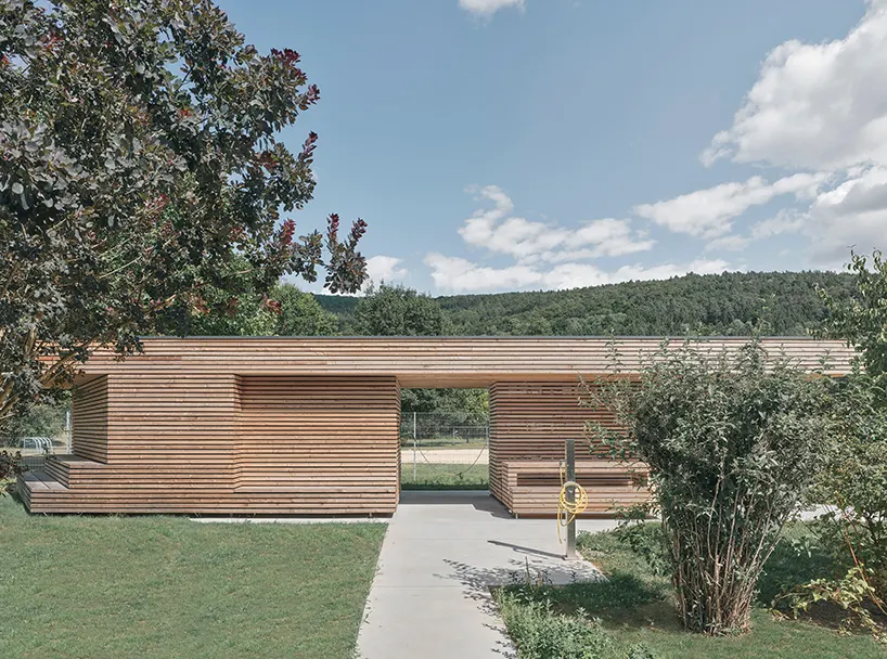 the building opens in all four directions, creating space to arrive, rest, and meet
