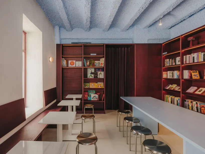 the main interior brings together the café, bookshop and communal seating within a compact space