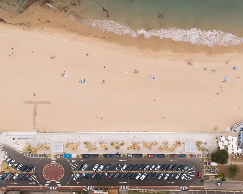 aerial view showing the sequence of planted areas, paved surfaces and sandy beach