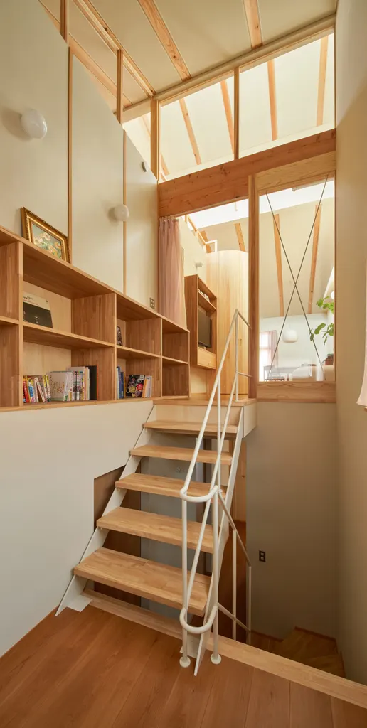 Stairs at the rear of the home lead to living spaces on the upper level