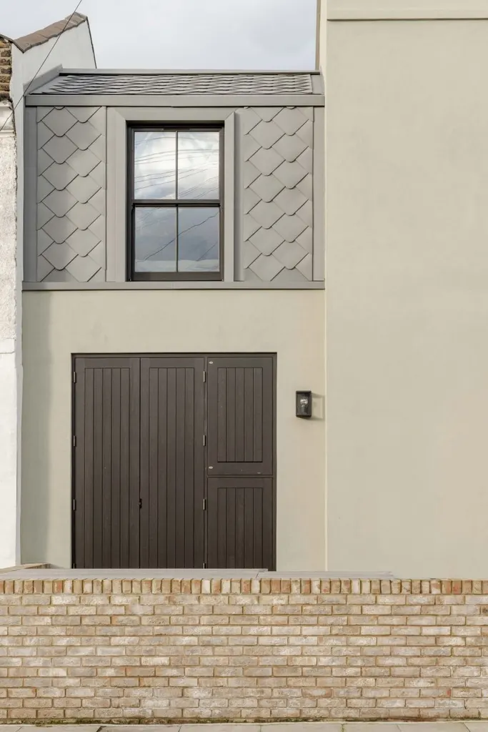Zinc shingles clad the extension