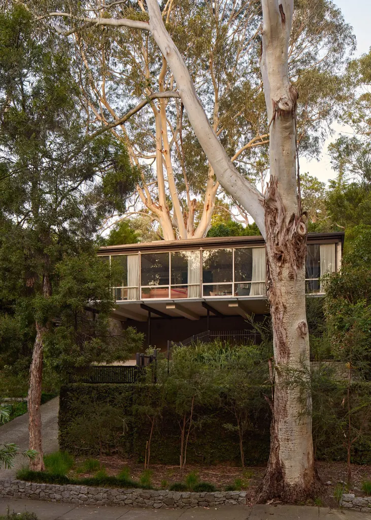 The glass-walled Guss House is among the featured projects