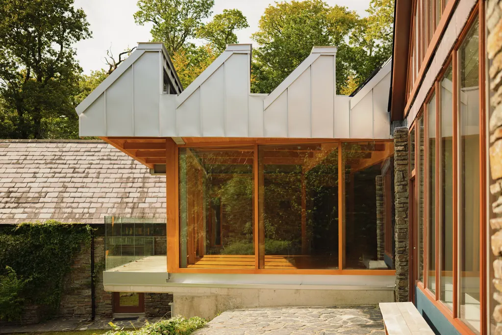 A new yoga studio connects its two existing stone buildings