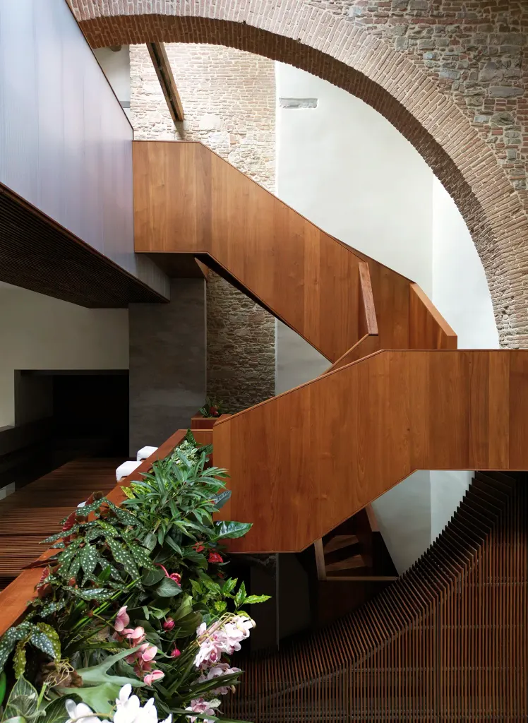 A new teak staircase is woven into the space