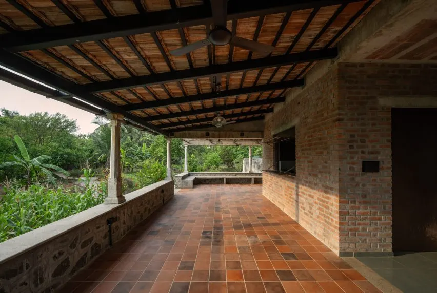 Granite stone pillars and Mangalore tiles complement the building's brick walls