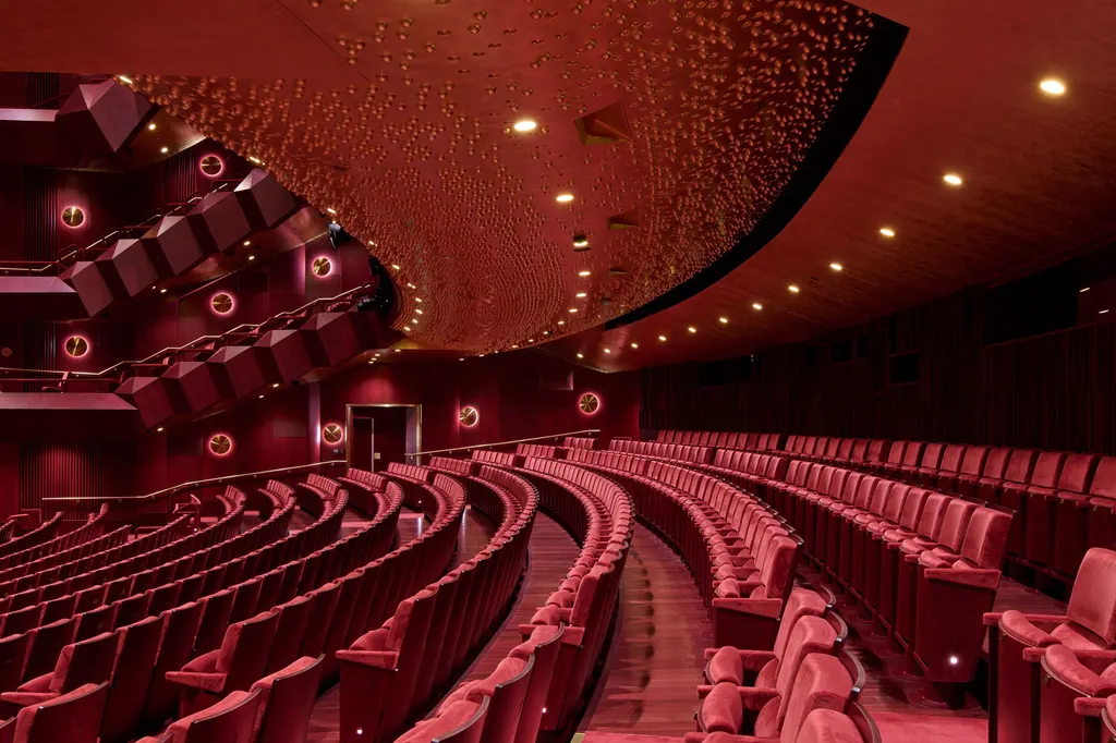 The auditorium ceiling features 75,000 etched brass spheres