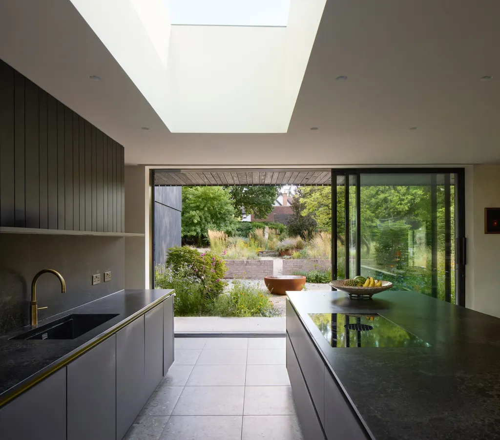 Openings wrap around a skylit living and dining space