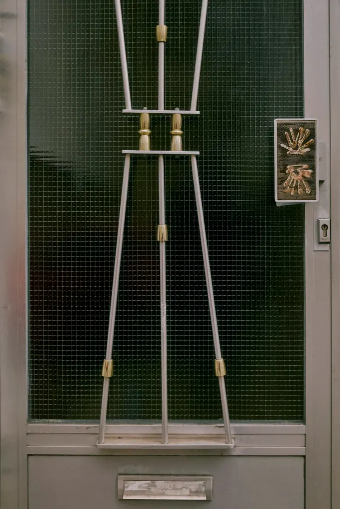 Bespoke enamel door handles, such as this example in Brussels, are a typical feature of Belgian post-war houses