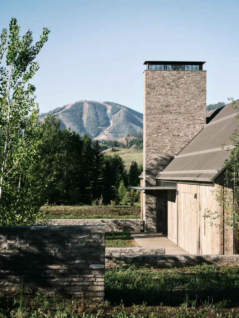 Three Barns by Field Architecture, a rural american home designed to look like a collection of old wooden barns