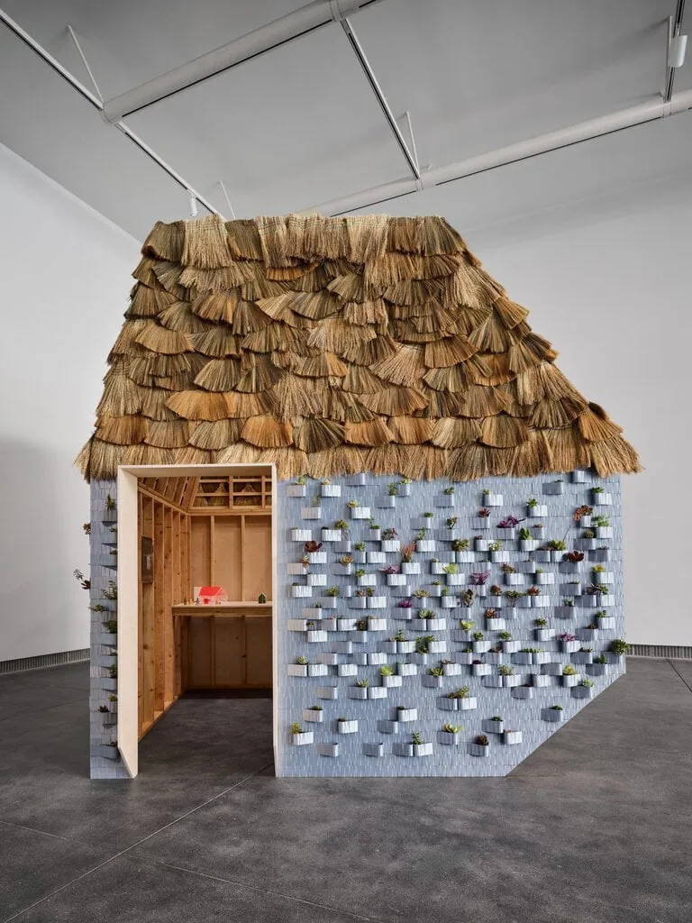 The Workshop has a roof made of brooms and walls of biodegradable thermoplastic