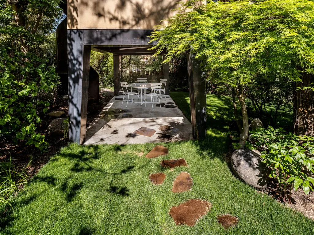 A patio sits under the house