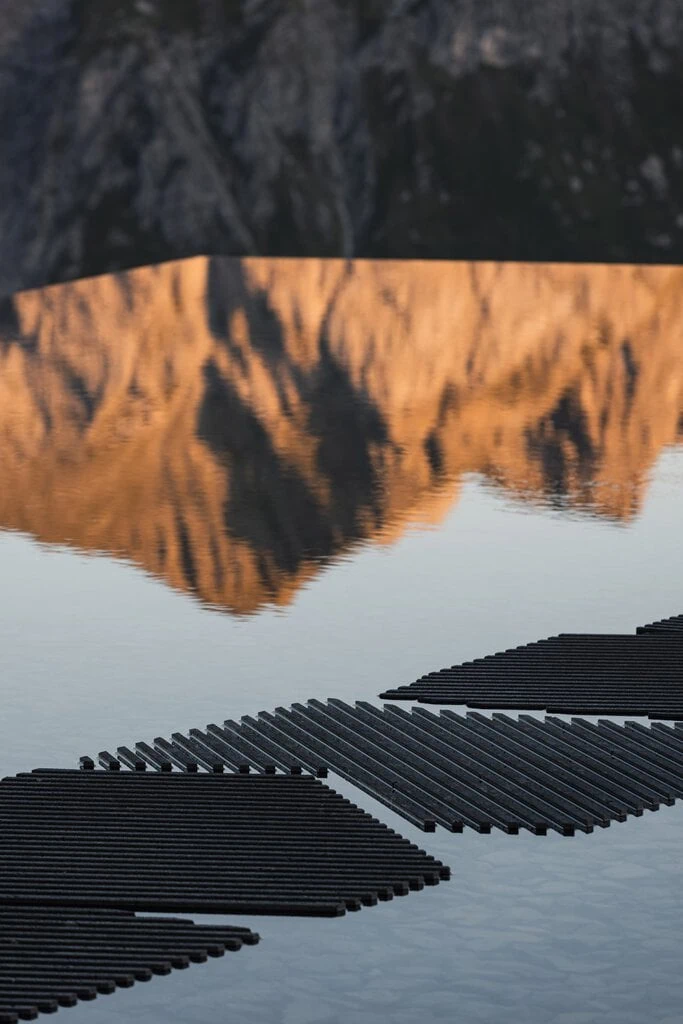 Striped stepping stones lead across the water