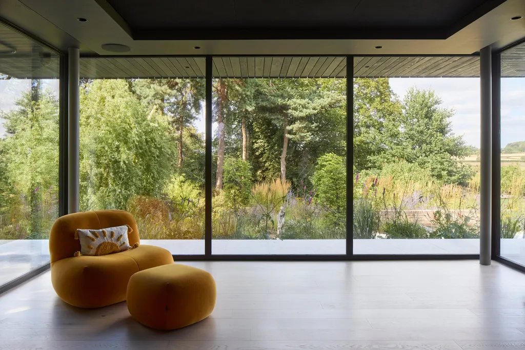 A glazed snug overlooks the garden to the rear