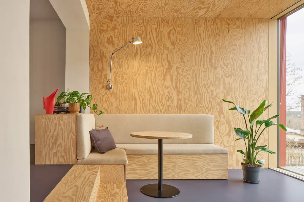 Built-in storage is concealed within the furniture