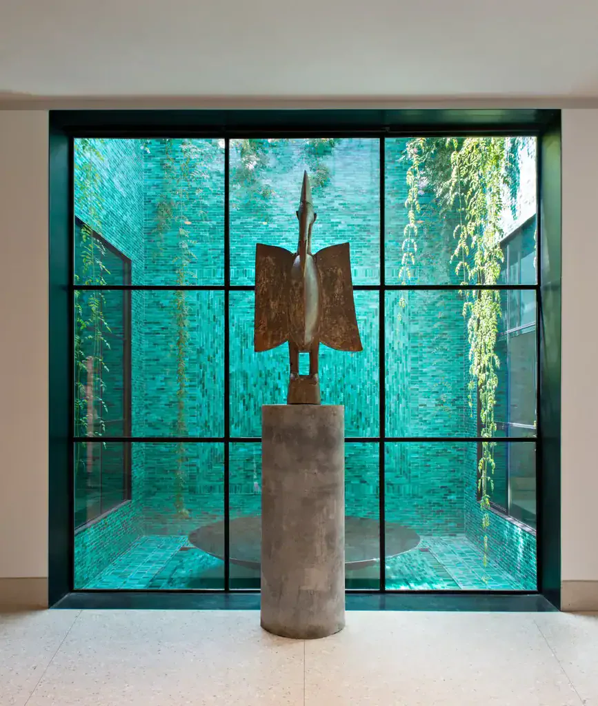 The airy, light, and plants-filled gallery rooms of Musée Yves Saint Laurent.