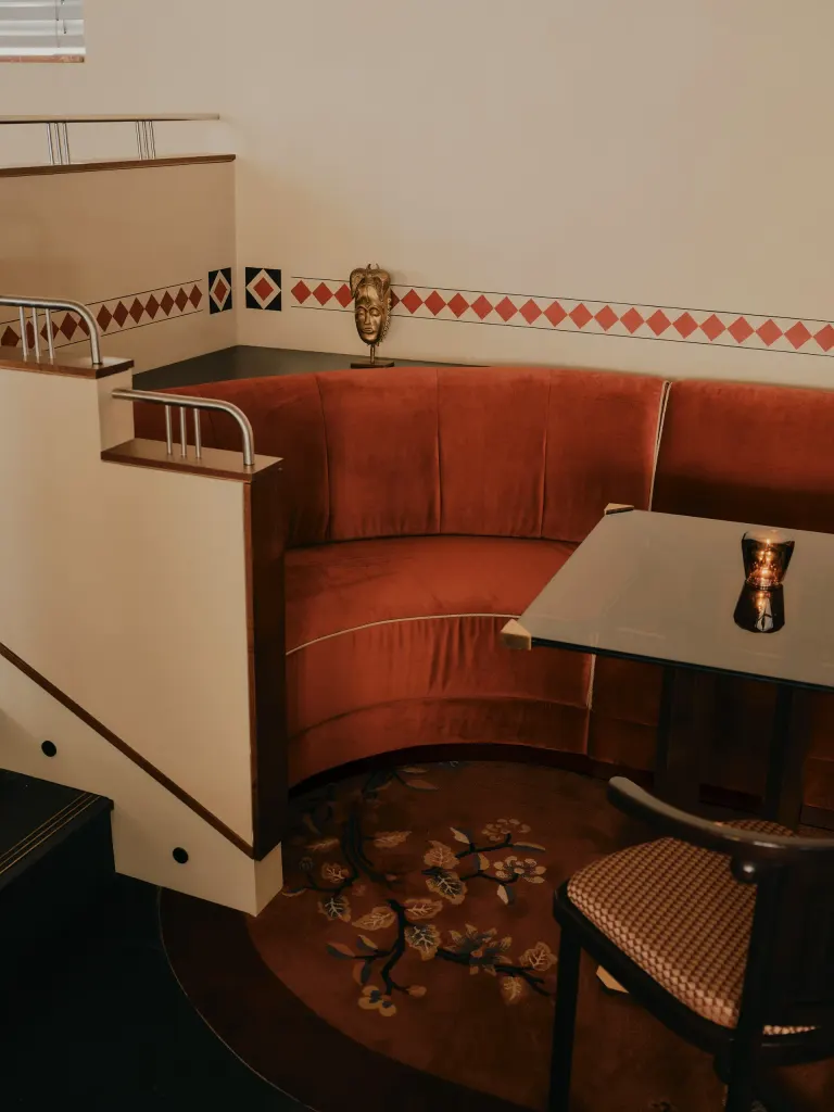 The metal handrails on the banister are a reference to the Jugendstil influences within the design. Image credit: Dean Hearne / The Dean Munich
