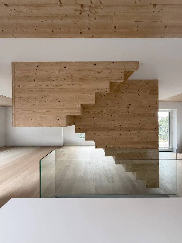 The staircase sits in the heart of the living area on the ground floor