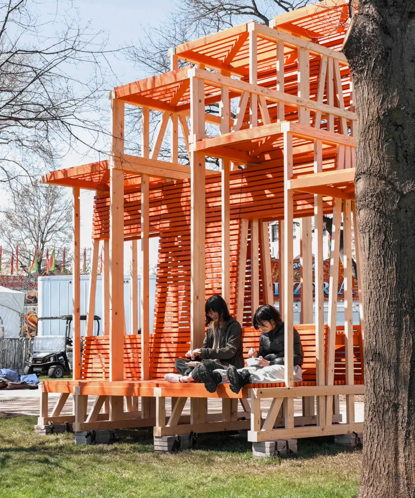 the inhabitable archway provides spaces for carnival-goers to gather and rest