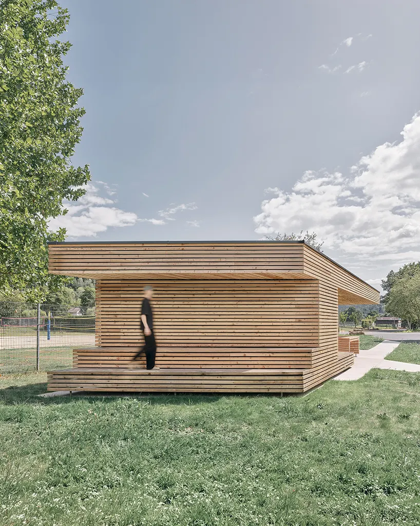 the compact architecture reinterprets the traditional image of stacked timber logs