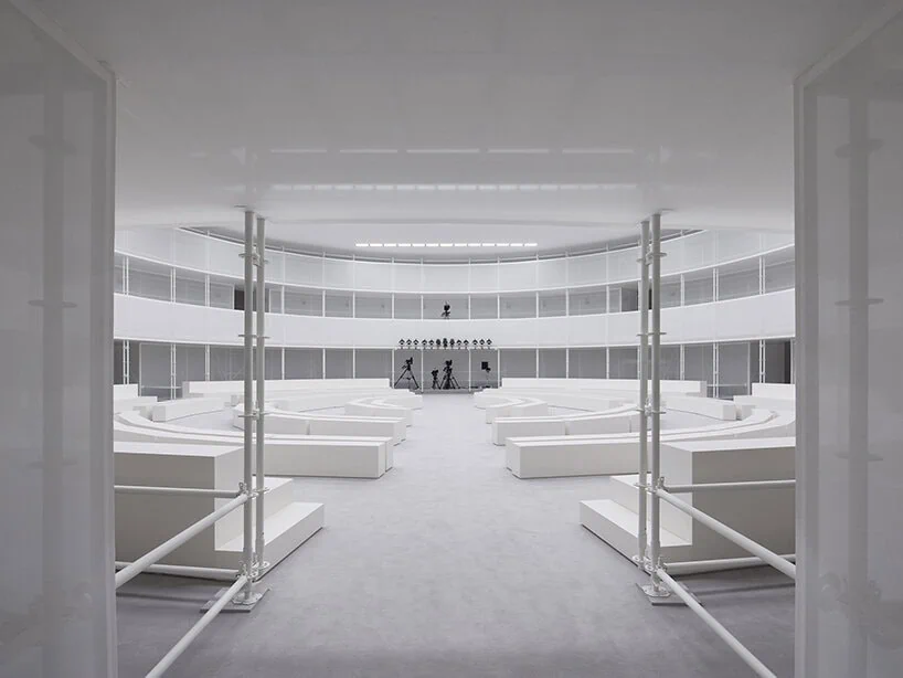 an upper balcony gives guests a second viewpoint over the spring summer 2027 collection