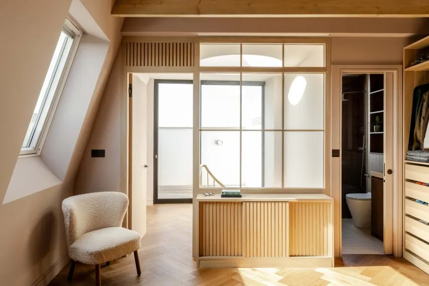On the top floor, an ensuite sits next to a bedroom