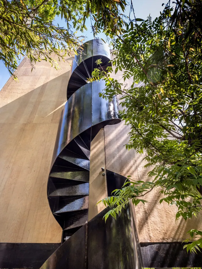 A spiral staircase provides access