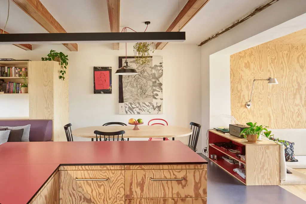 Red accents complement the statement metal-clad exterior