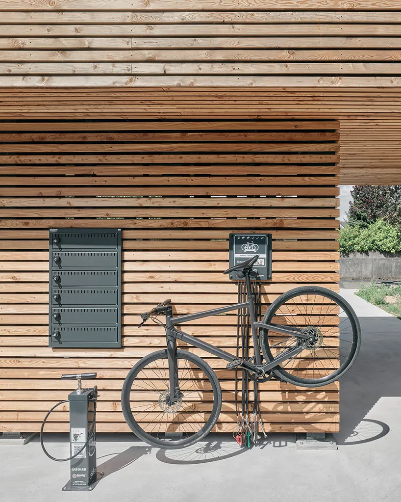 the station combines sheltered seating, digital information, e-bike charging points, and cycle services