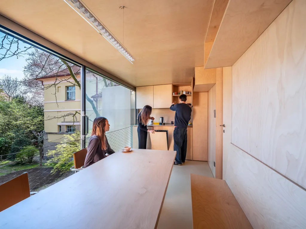 The first floor contains a kitchen and dining space
