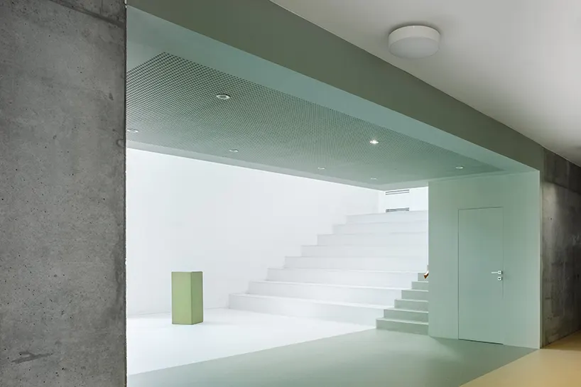 the central atrium functions interchangeably as an auditorium, media library, and event venue