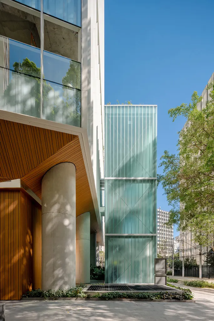 screen-printed patterns form a graphic layer across the glass facade