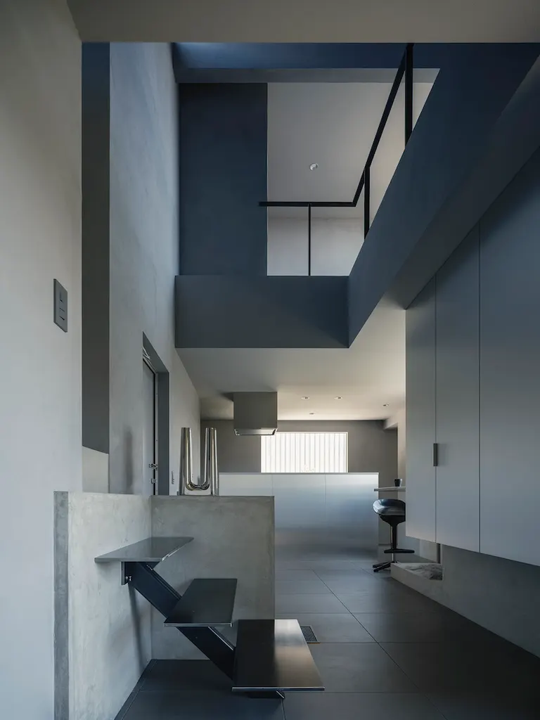 a double-height space connects the upper and lower levels