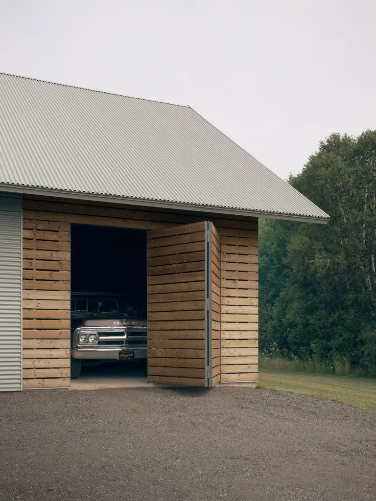 Wooden slats demarcate the workshop and garage