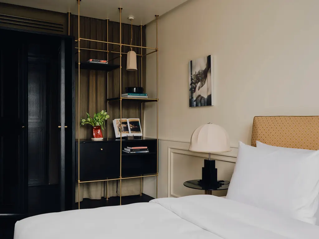 Tatjana also toned down what were gold shelves and wrapped them in matte black to further soften the space.